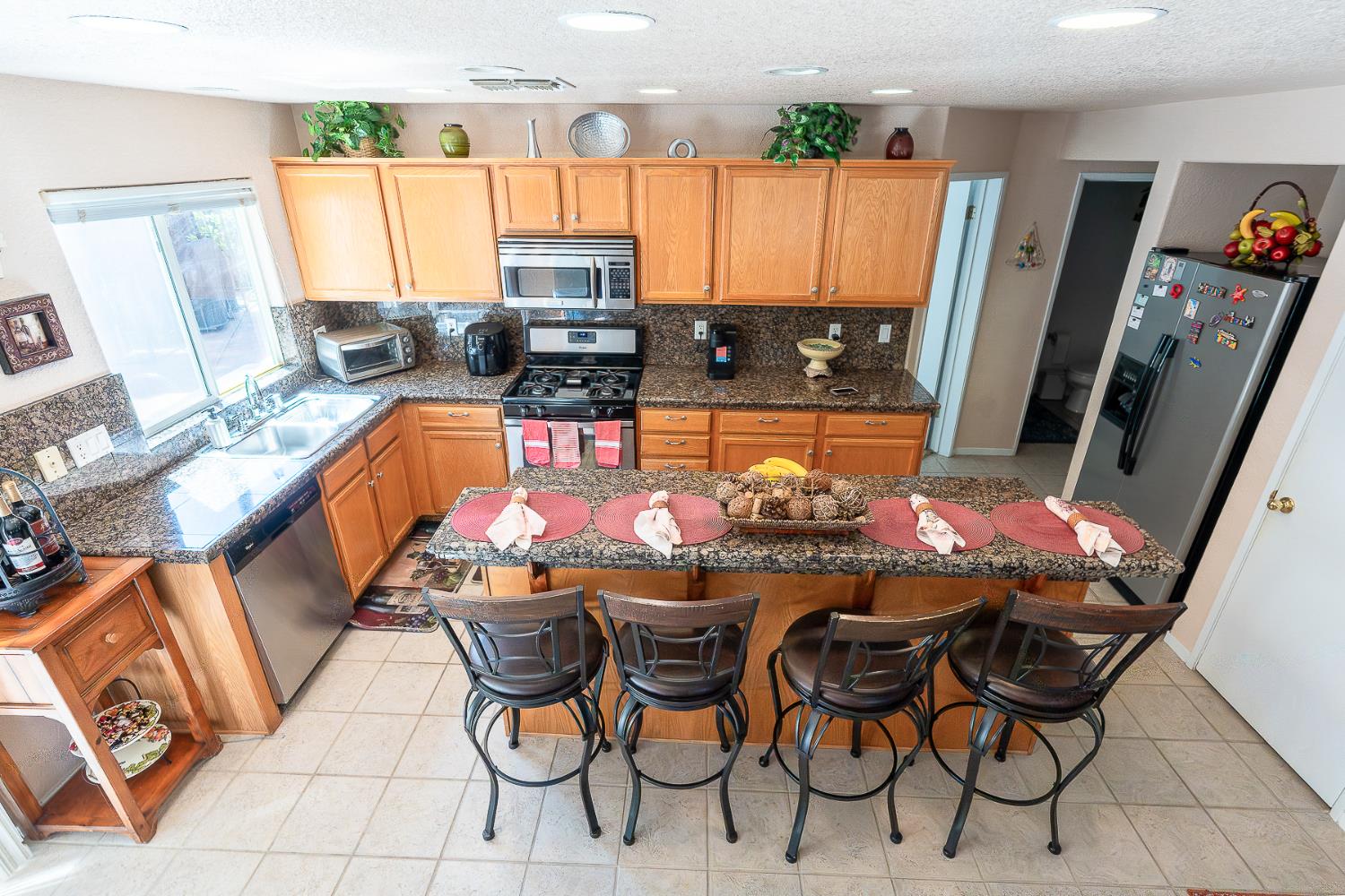 4237 Narraganset Way Mather, CA 95655 - Photo 8 of 40 a outdoor dining space with furniture and a view of kitchen