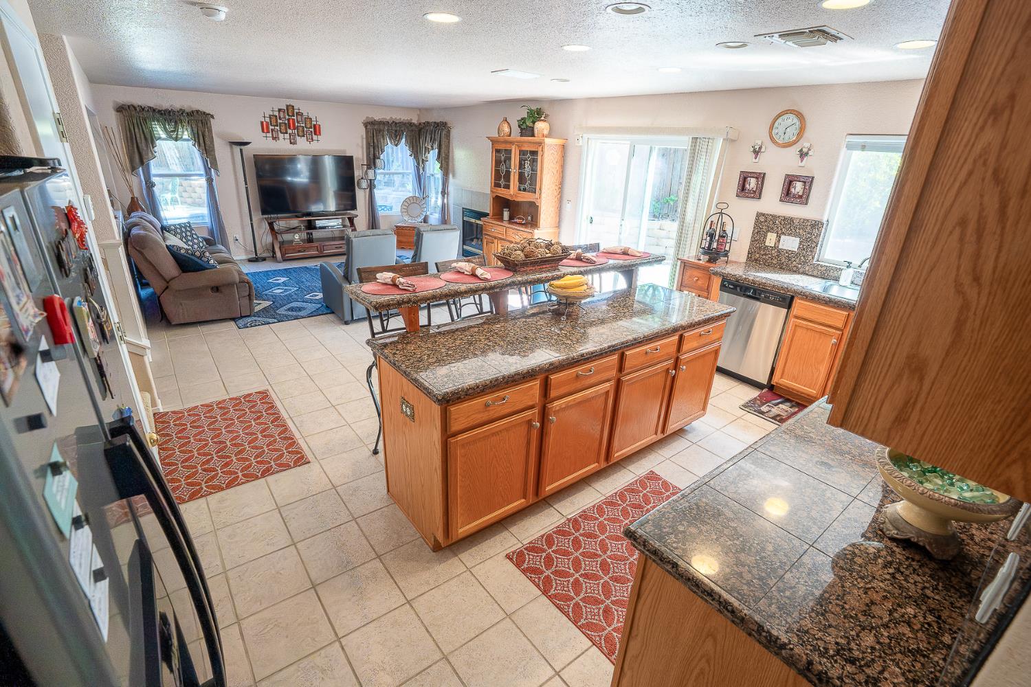 4237 Narraganset Way Mather, CA 95655 - Photo 9 of 40 a living room with furniture and a flat screen tv