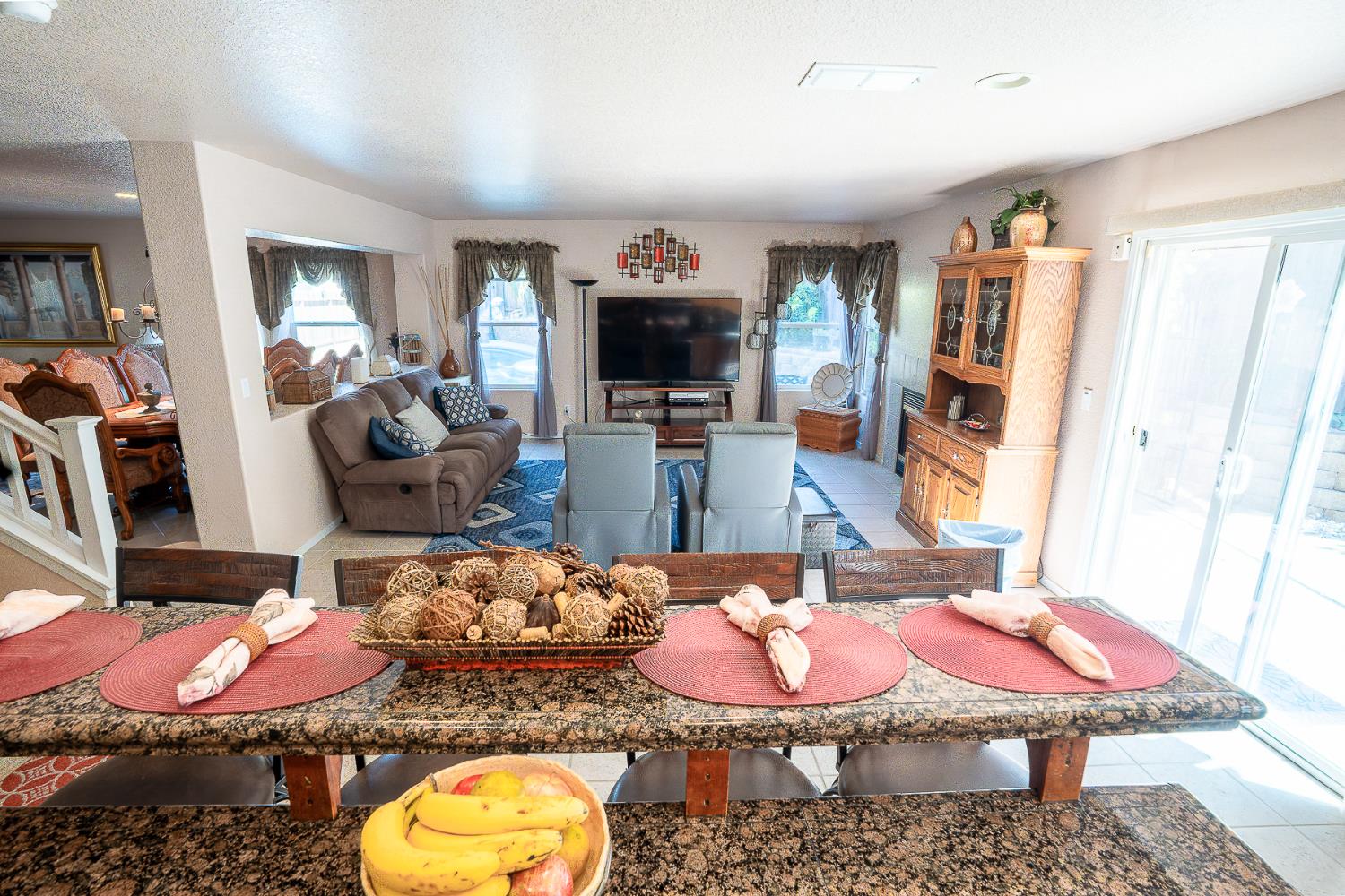 4237 Narraganset Way Mather, CA 95655 - Photo 10 of 40 a living room with furniture and a fireplace