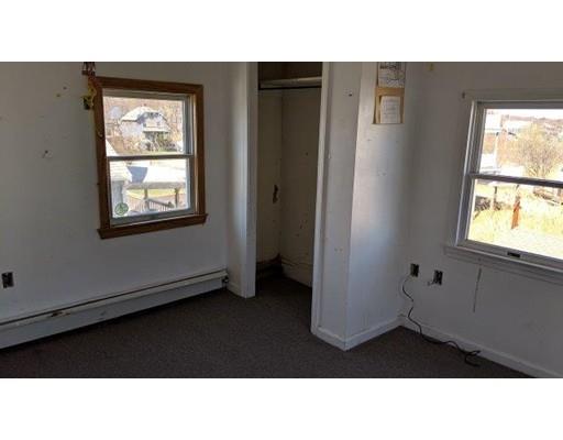 145 Jericho Road Scituate, MA 02066 - Photo 12 of 14 a black and white photo of a living room