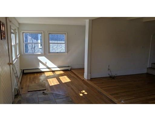 145 Jericho Road Scituate, MA 02066 - Photo 3 of 14 a black and white photo of a living room