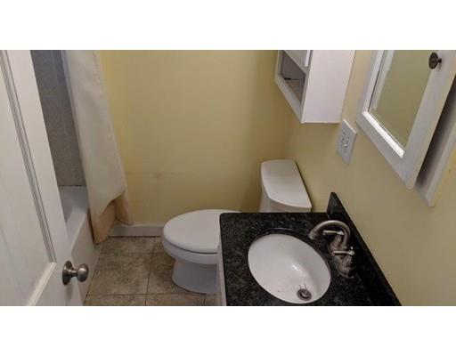 145 Jericho Road Scituate, MA 02066 - Photo 4 of 14 a bathroom with a sink mirror vanity and toilet