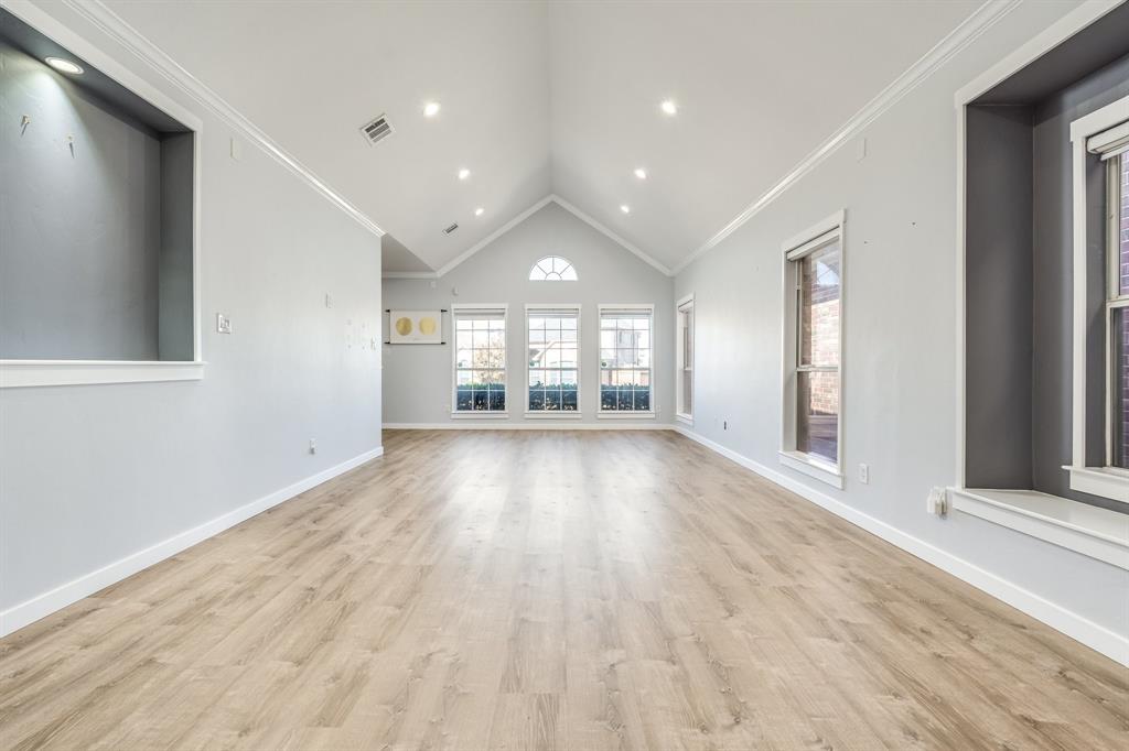 2300 Janna Way Carrollton, TX 75006 - Photo 12 of 40 wooden floor in an empty room with a window