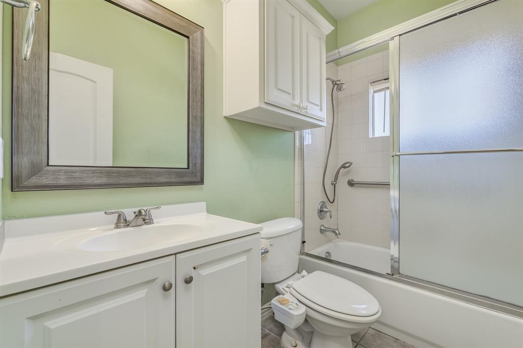 2300 Janna Way Carrollton, TX 75006 - Photo 15 of 40 a bathroom with a sink toilet and shower