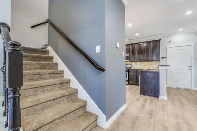 a view of entryway and kitchen