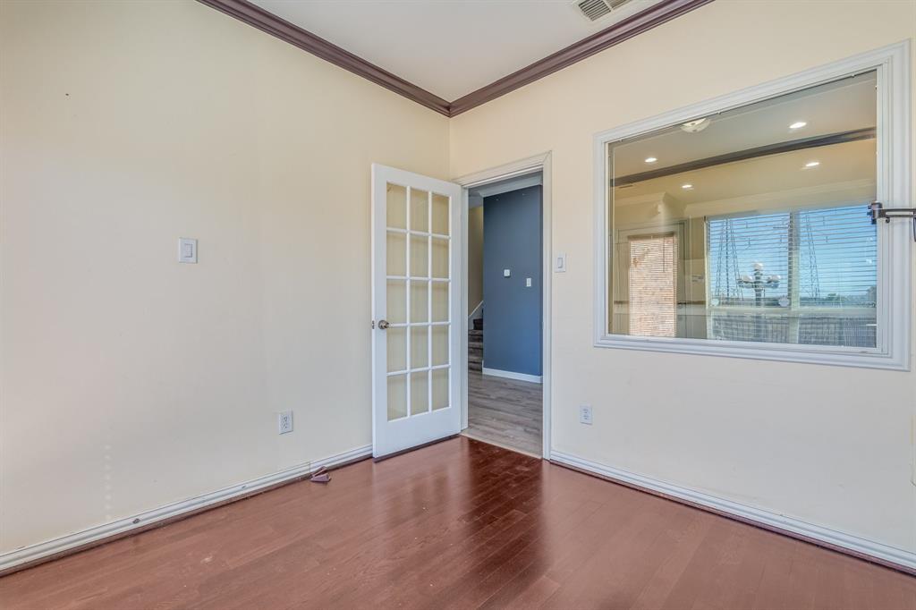 2300 Janna Way Carrollton, TX 75006 - Photo 24 of 40 an empty room with wooden floor and windows