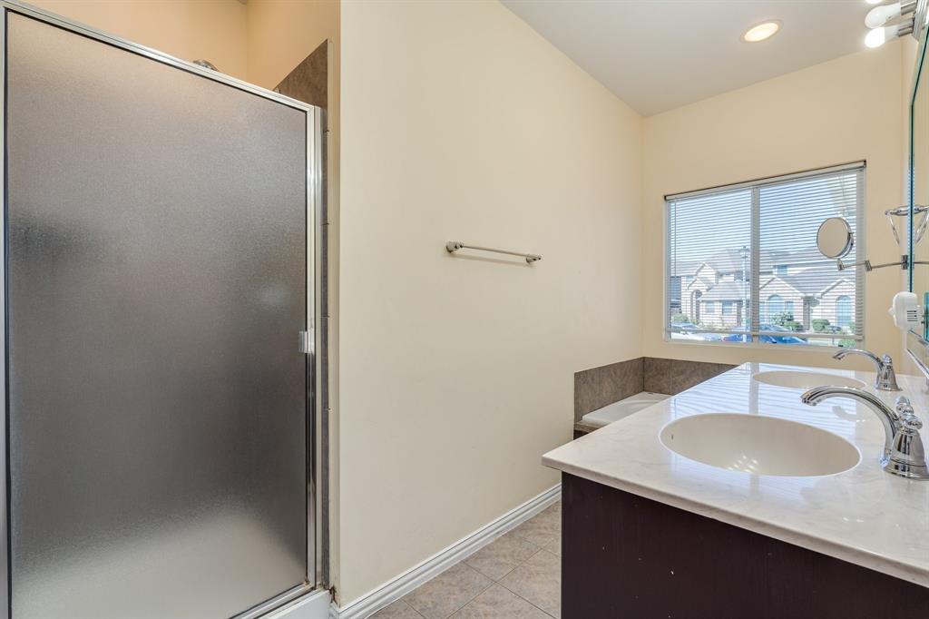 2300 Janna Way Carrollton, TX 75006 - Photo 29 of 40 a bathroom with a sink and a mirror