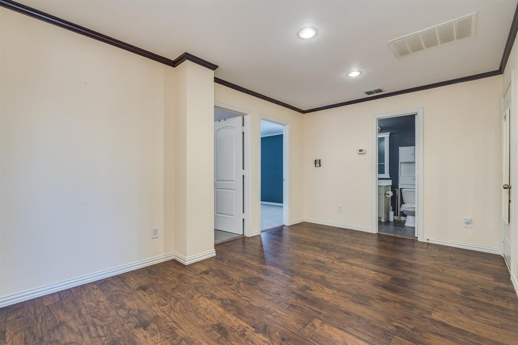 2300 Janna Way Carrollton, TX 75006 - Photo 32 of 40 a view of an empty room with wooden floor and a window