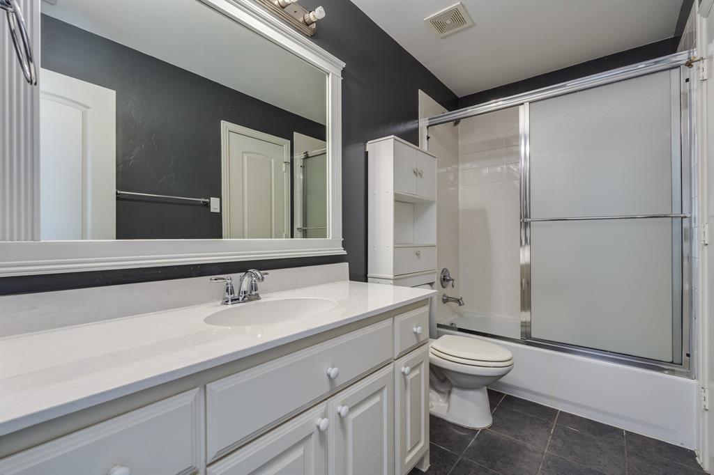 2300 Janna Way Carrollton, TX 75006 - Photo 38 of 40 a bathroom with a sink toilet and shower