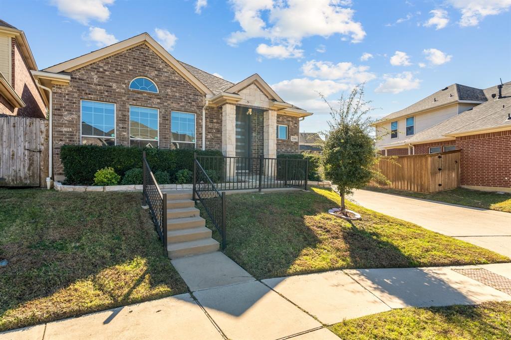 2300 Janna Way Carrollton, TX 75006 - Photo 6 of 40 a front view of a house with a yard