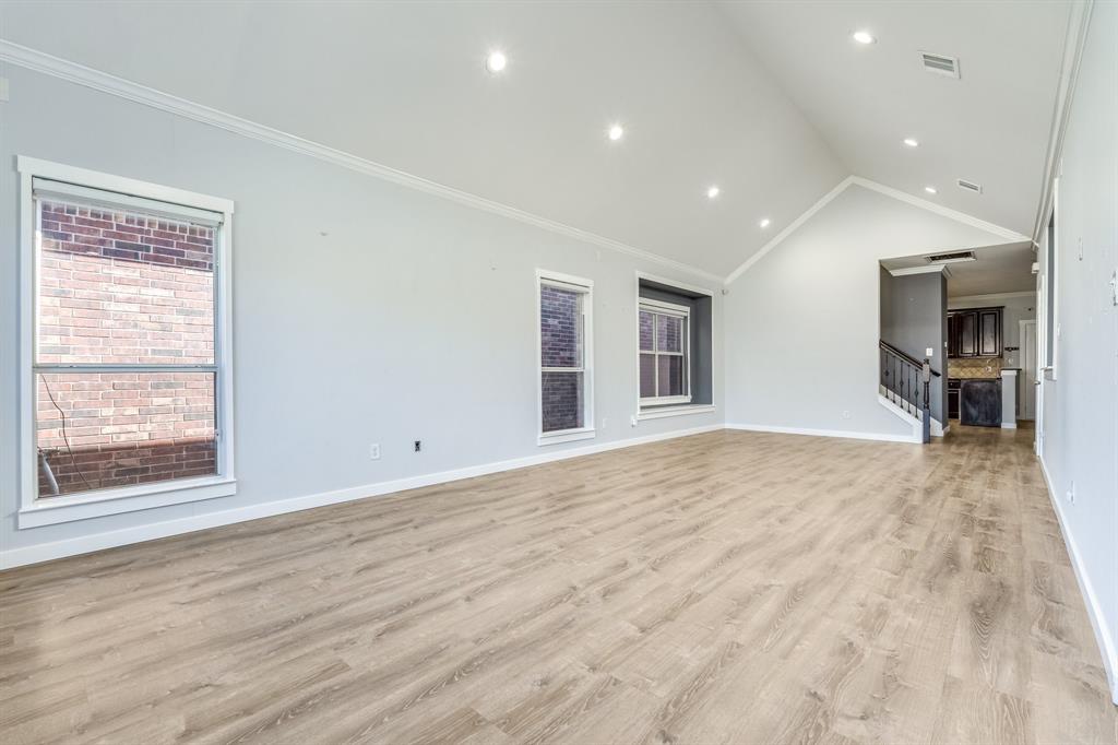 2300 Janna Way Carrollton, TX 75006 - Photo 10 of 40 a view of empty room with wooden floor and fan