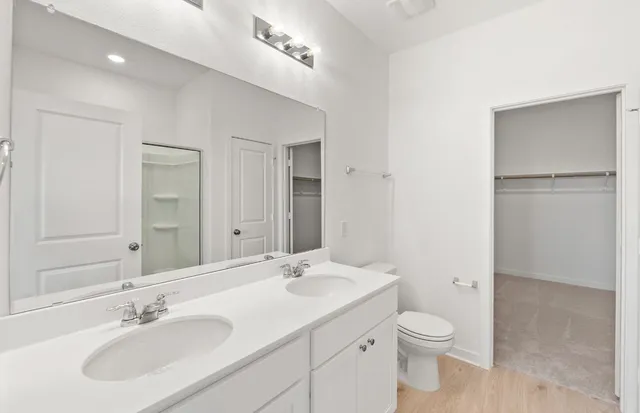 a bathroom with a sink and shower