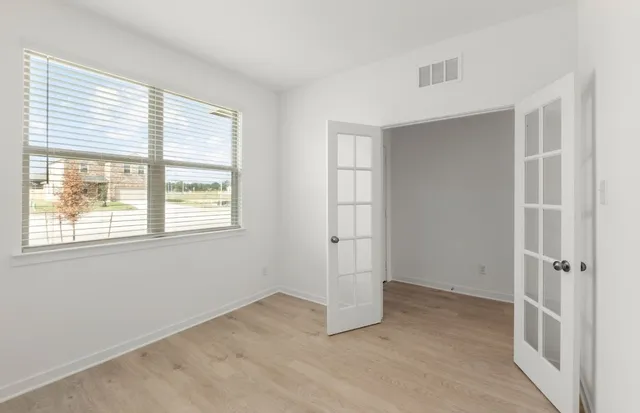 a view of an empty room with a window