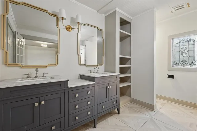 a spacious bathroom with a granite countertop sink mirror and double