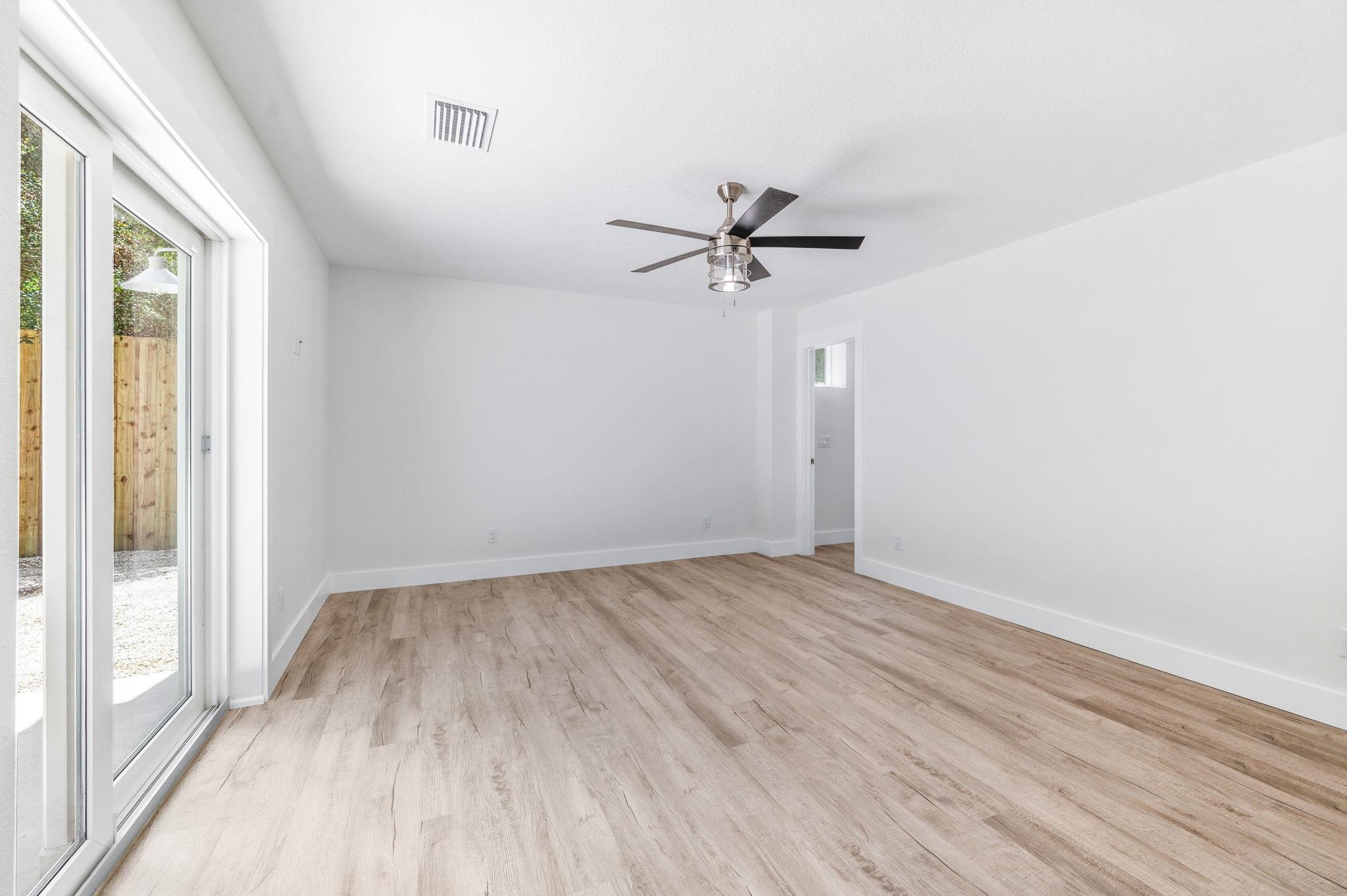 6132 Highway 1 St. Augustine, FL 32086 - Photo 14 of 55 wooden floor in an empty room with a window