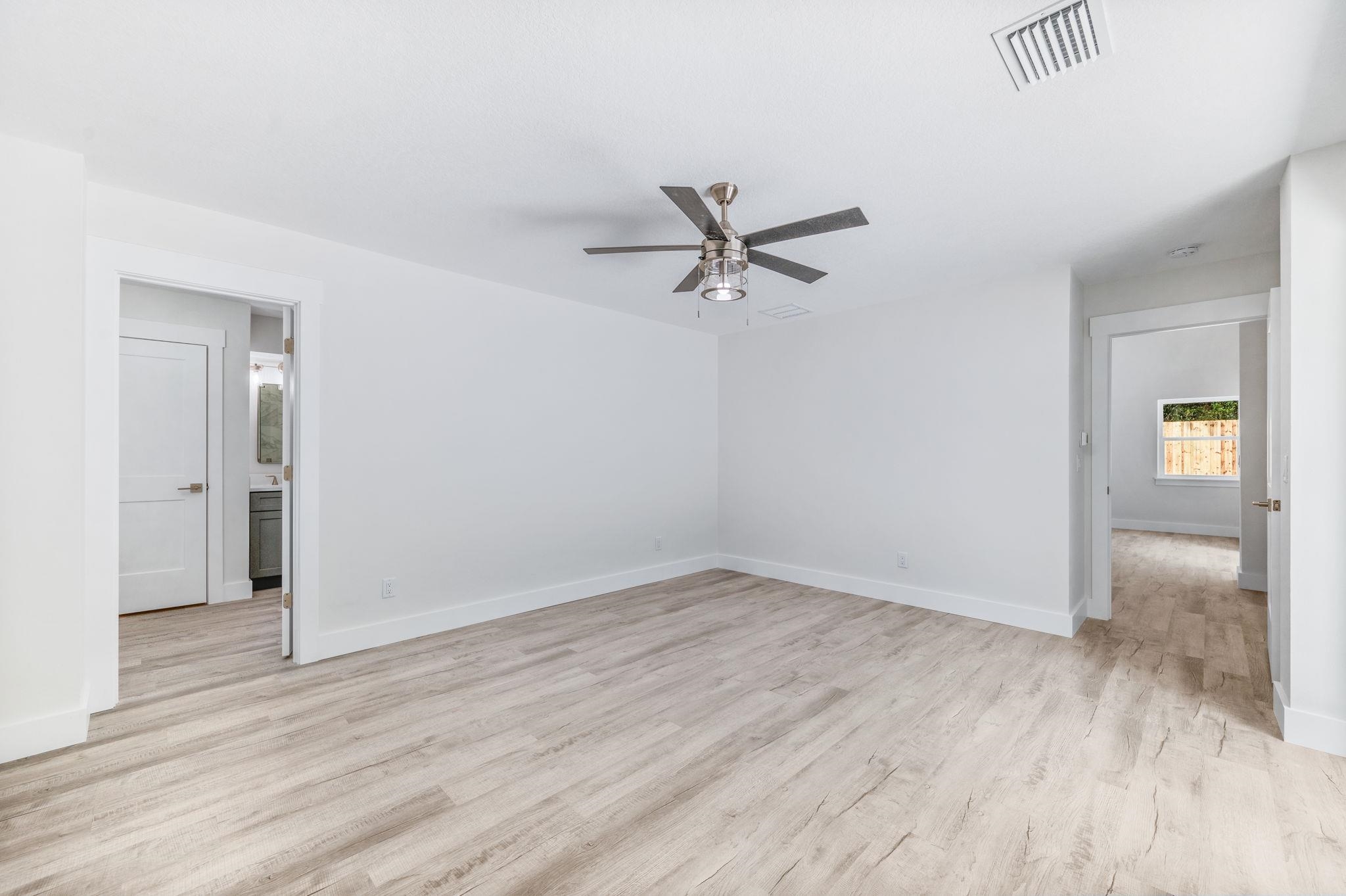 6132 Highway 1 St. Augustine, FL 32086 - Photo 15 of 55 a view of a room with wooden floor and a ceiling fan