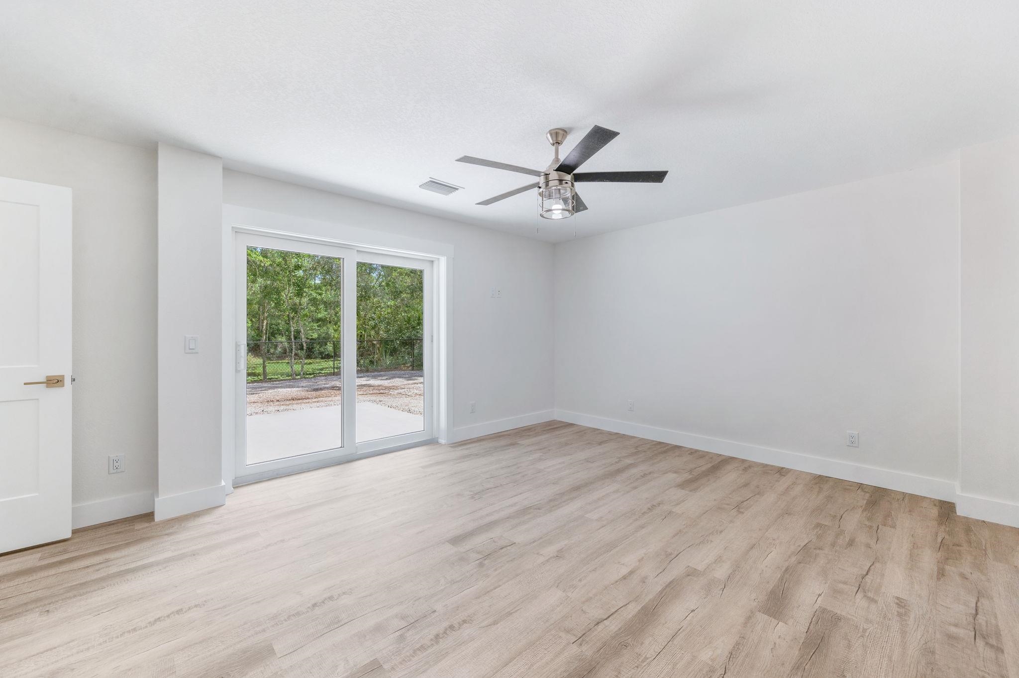 6132 Highway 1 St. Augustine, FL 32086 - Photo 16 of 55 a view of empty room with wooden floor and fan
