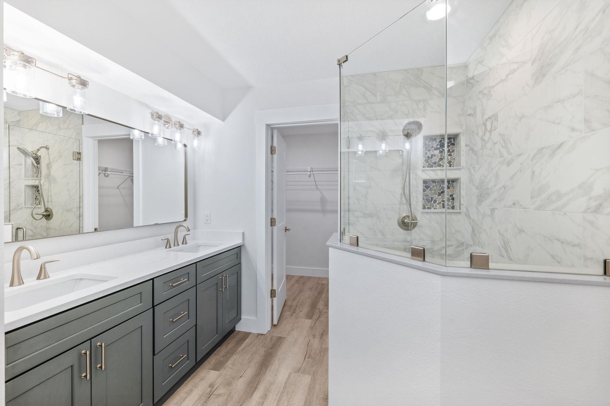 6132 Highway 1 St. Augustine, FL 32086 - Photo 18 of 55 a bathroom with a double vanity sink mirror and shower