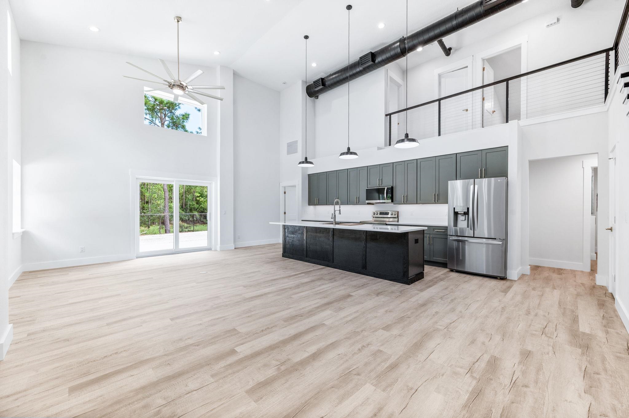 6132 Highway 1 St. Augustine, FL 32086 - Photo 2 of 55 a large white kitchen with a large window cabinets and stainless steel appliances