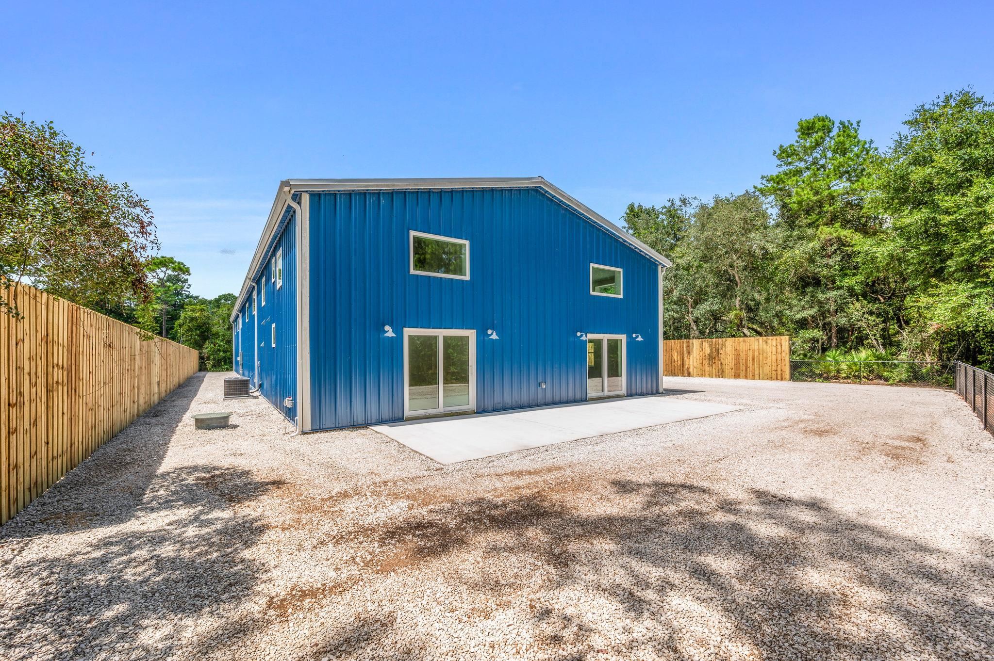 6132 Highway 1 St. Augustine, FL 32086 - Photo 22 of 55 a front view of a house with a yard