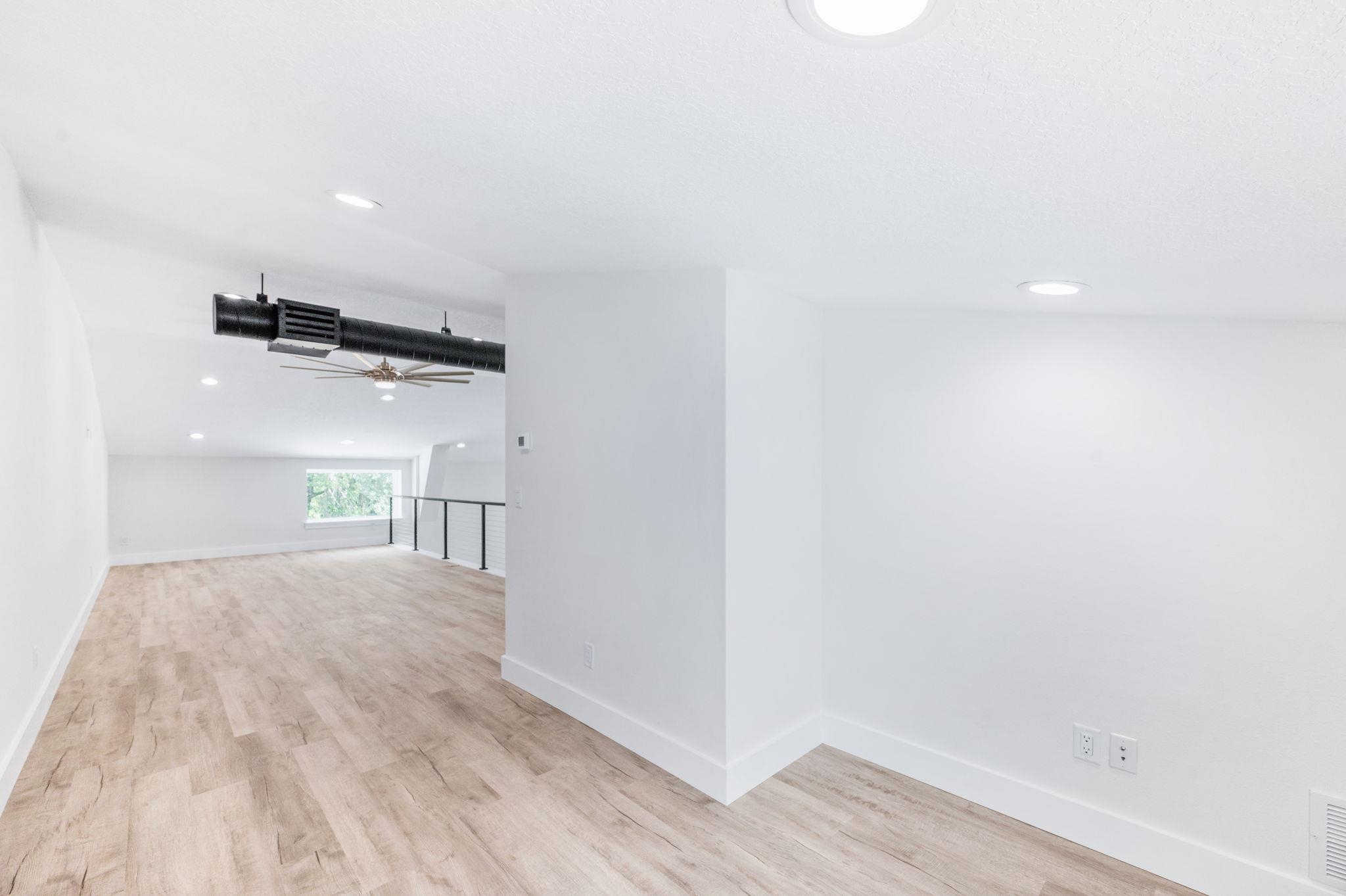 6132 Highway 1 St. Augustine, FL 32086 - Photo 29 of 55 a view of a big room with wooden floor and windows