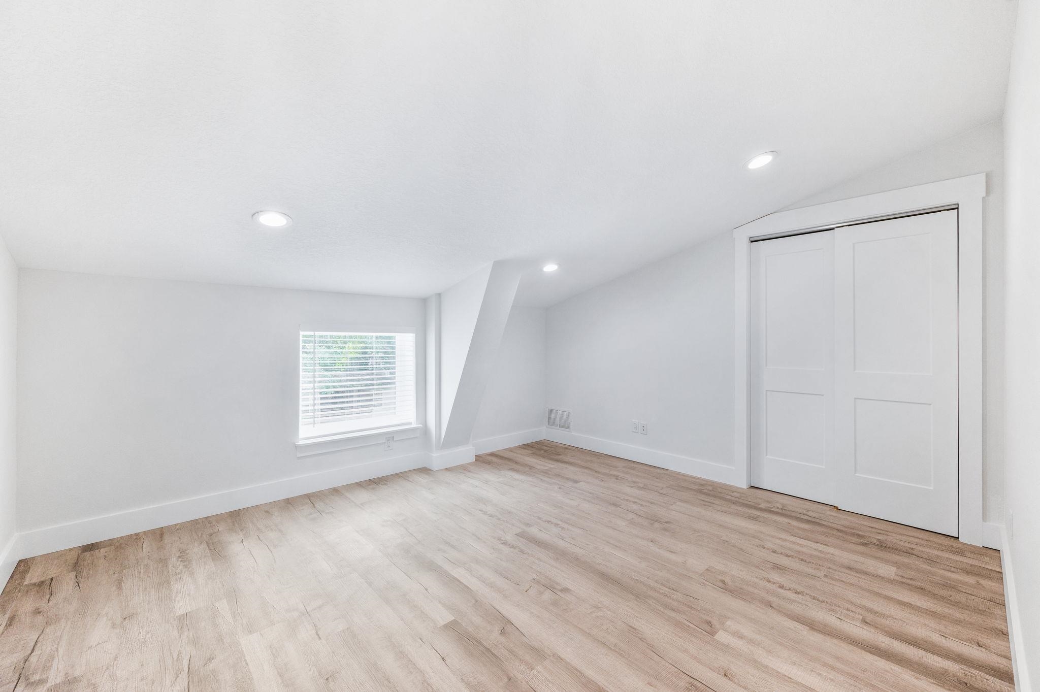 6132 Highway 1 St. Augustine, FL 32086 - Photo 32 of 55 an empty room with wooden floor and windows