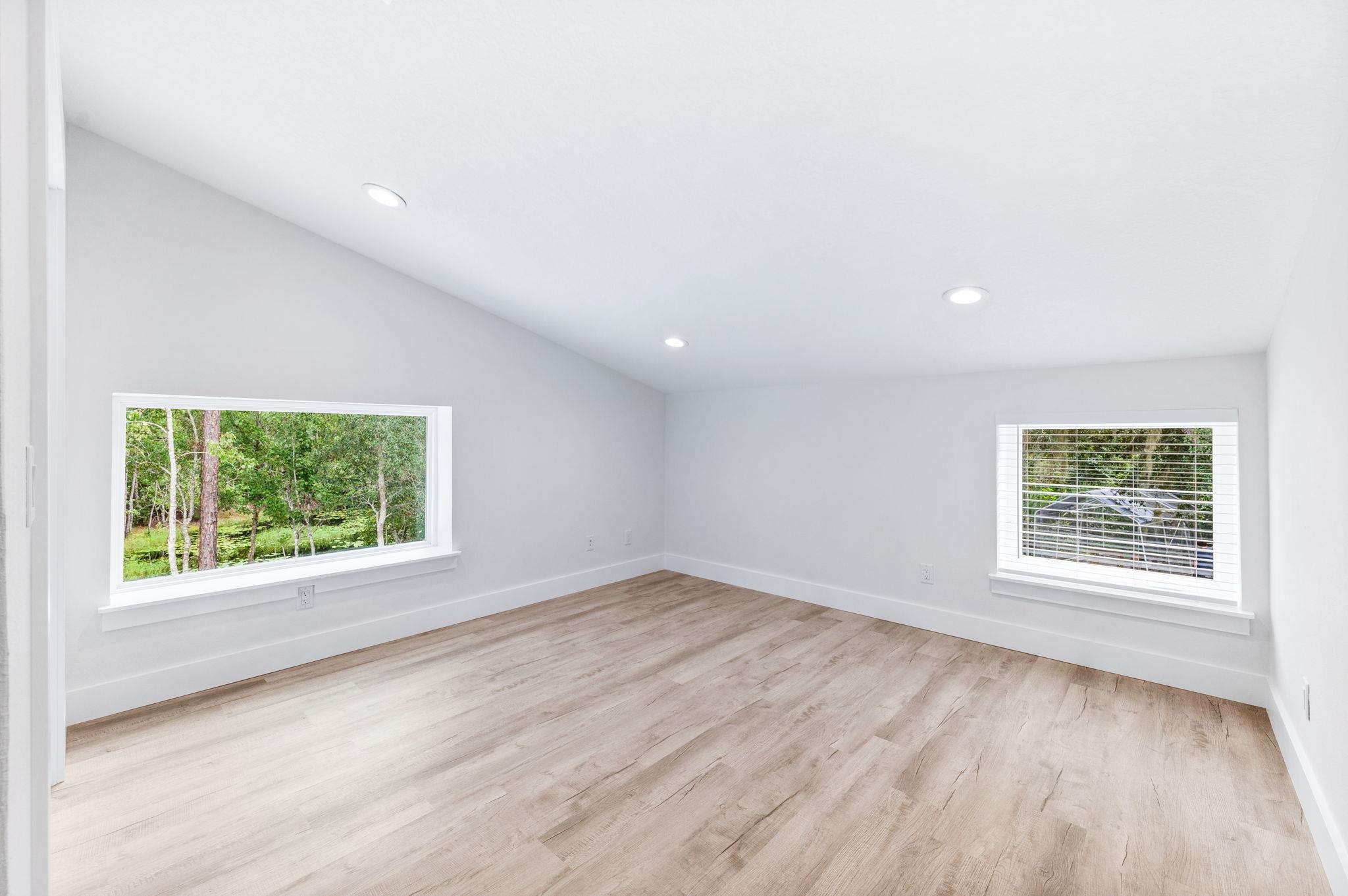 6132 Highway 1 St. Augustine, FL 32086 - Photo 36 of 55 an empty room with wooden floor and windows