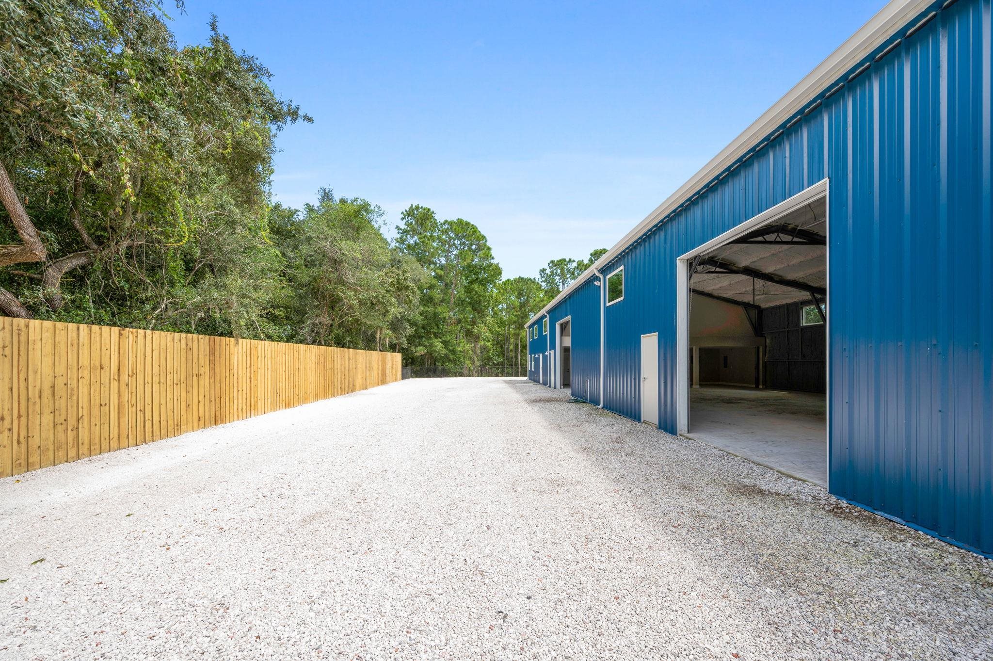6132 Highway 1 St. Augustine, FL 32086 - Photo 50 of 55 a view of backyard with small cabin and wooden fence