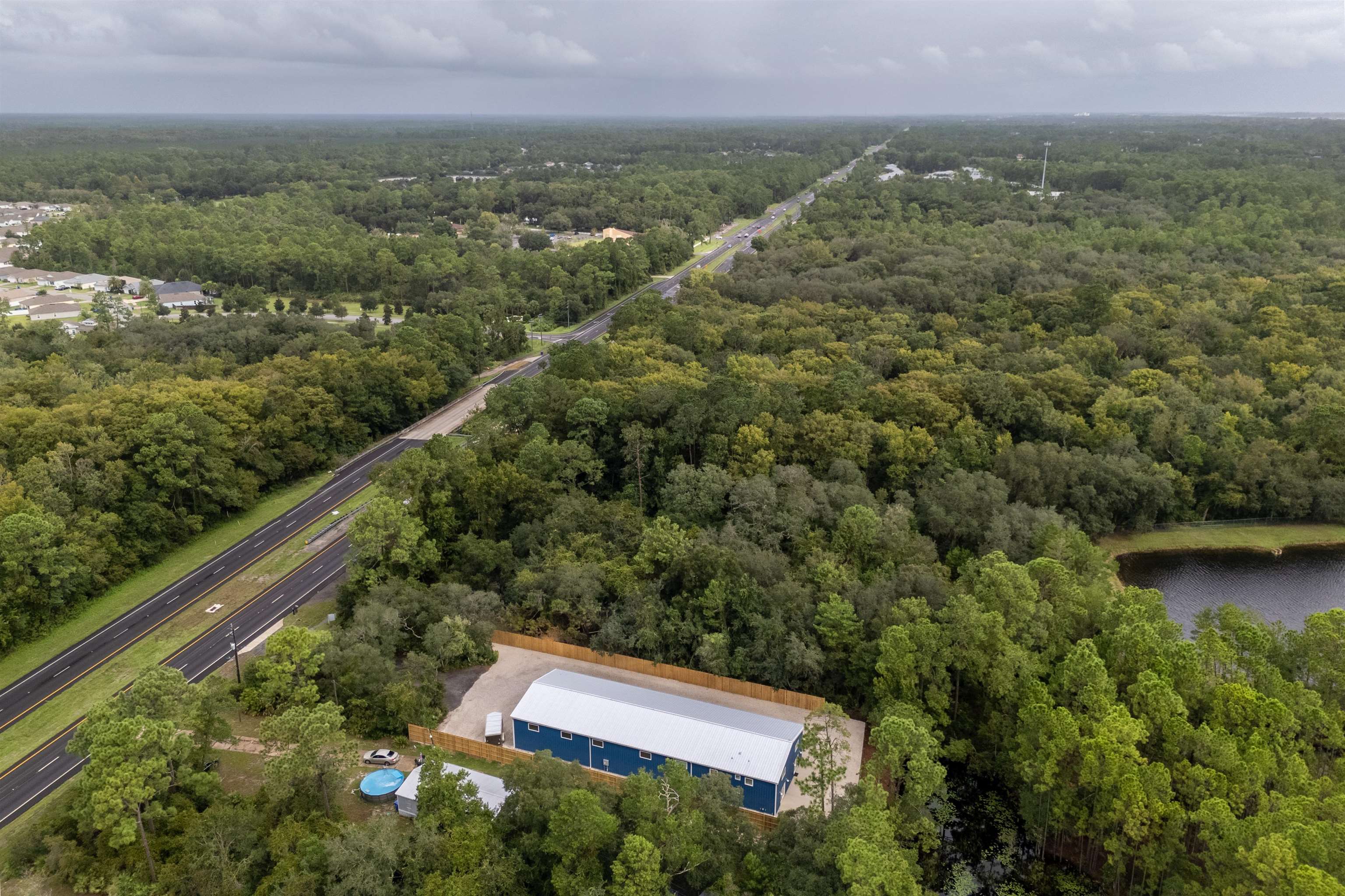 6132 Highway 1 St. Augustine, FL 32086 - Photo 55 of 55 an aerial view of residential house with outdoor space and trees around
