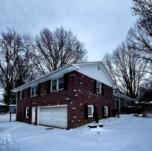 305 Tremont Road Akron, OH 44313 - Photo 25 of 25 Snow covered property featuring a garage