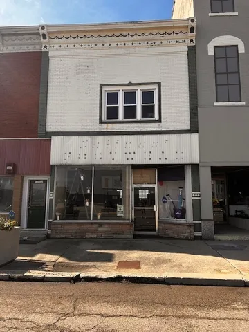 a view of a building with car windows