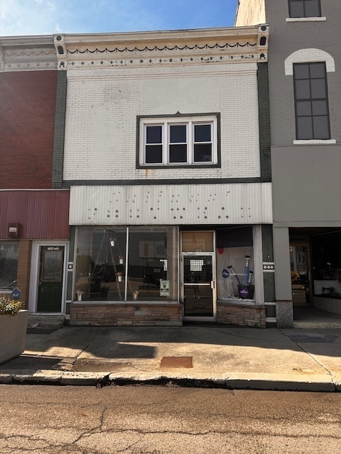 a view of a building with car windows
