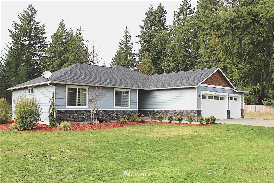 17325 Littlerock Road Southwest Rochester, WA 98579 - Photo 1 of 20 a front view of house with yard and green space