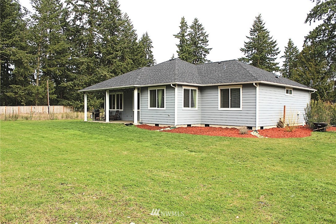17325 Littlerock Road Southwest Rochester, WA 98579 - Photo 3 of 20 a front view of house with yard and green space