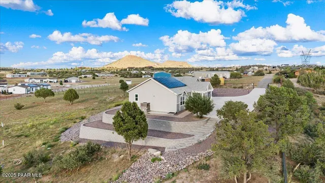 an aerial view of a house with a lake view