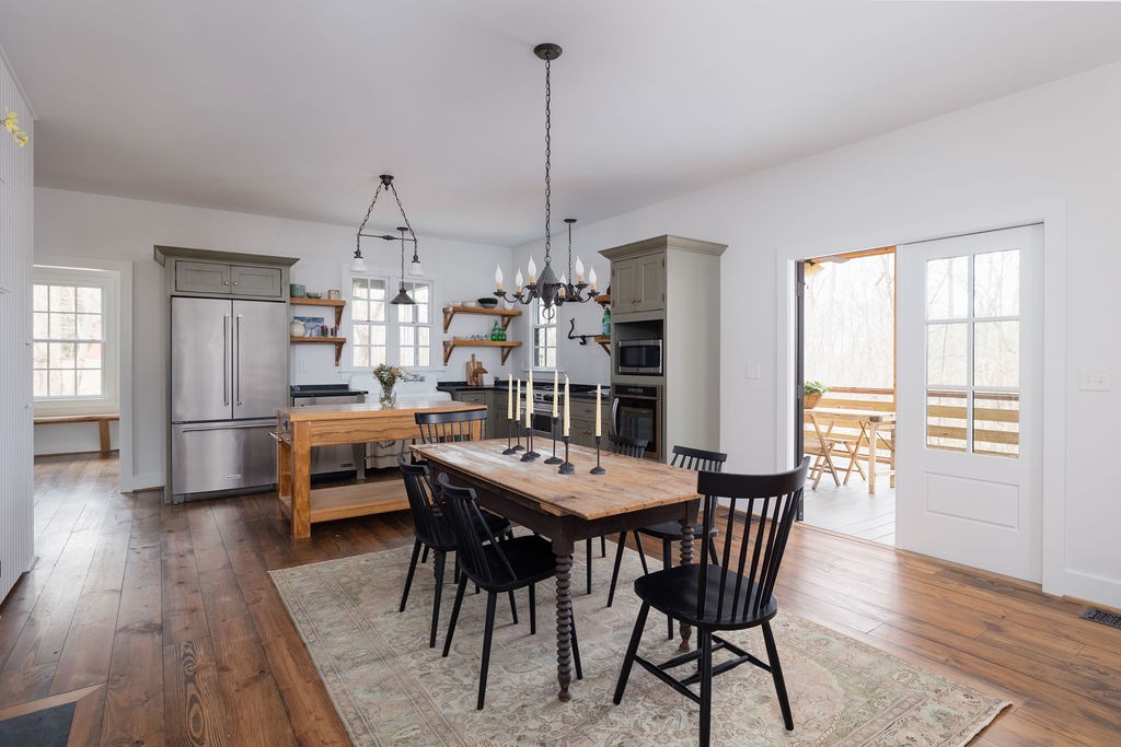 5184 Fire Tower Road Franklin, TN 37064 - Photo 12 of 70 a view of a dining room with furniture window and wooden floor
