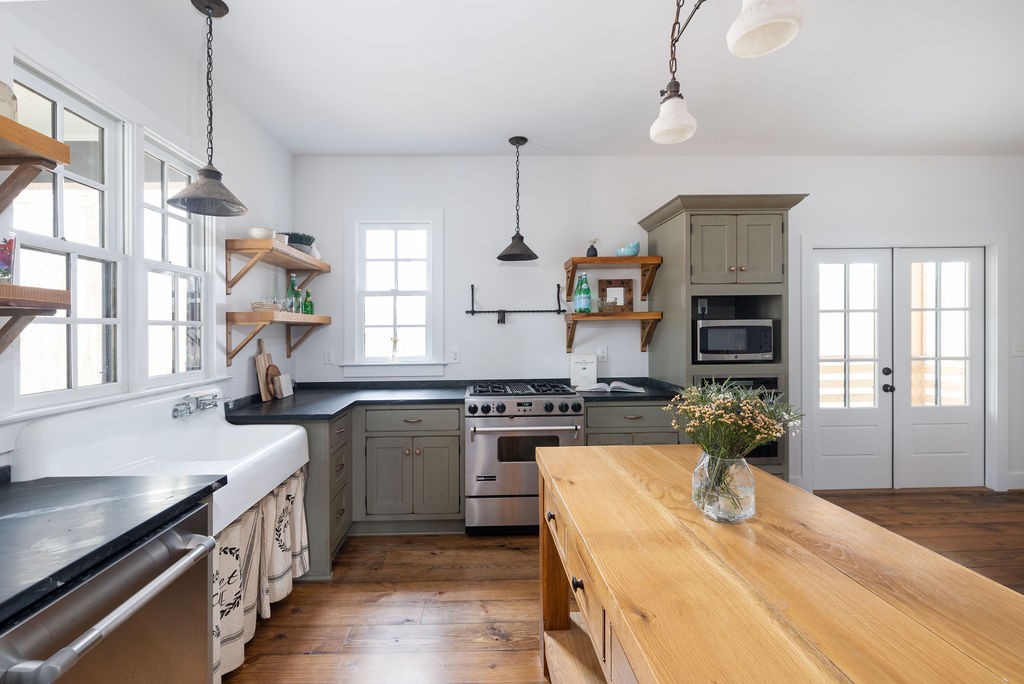 5184 Fire Tower Road Franklin, TN 37064 - Photo 14 of 70 a kitchen with a stove and a wooden floor