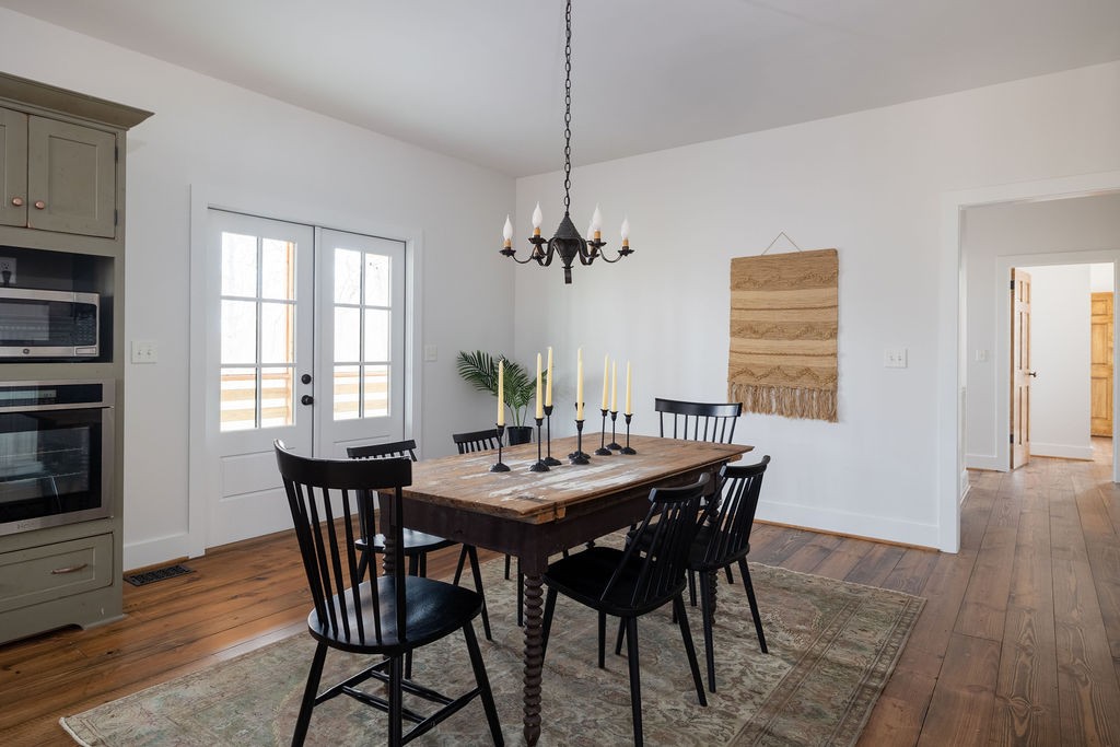 5184 Fire Tower Road Franklin, TN 37064 - Photo 16 of 70 a view of a dining room with furniture window and wooden floor