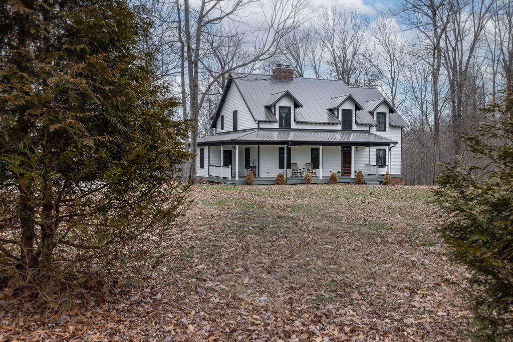 5184 Fire Tower Road Franklin, TN 37064 - Photo 2 of 70 a view of a white house next to a road with large trees