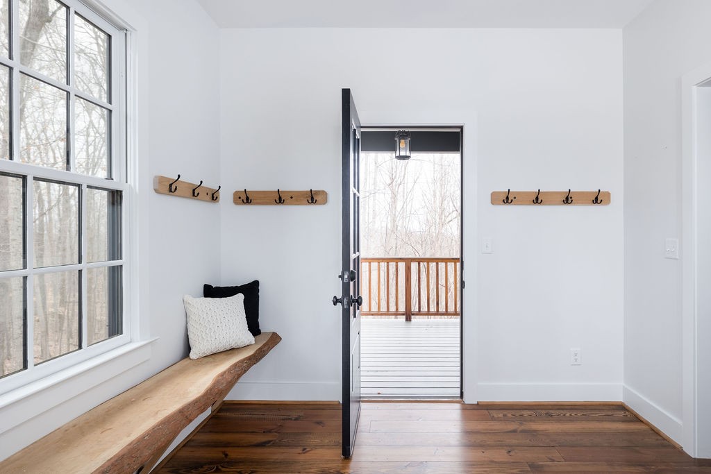 5184 Fire Tower Road Franklin, TN 37064 - Photo 24 of 70 a view of a hallway with wooden floor and windows