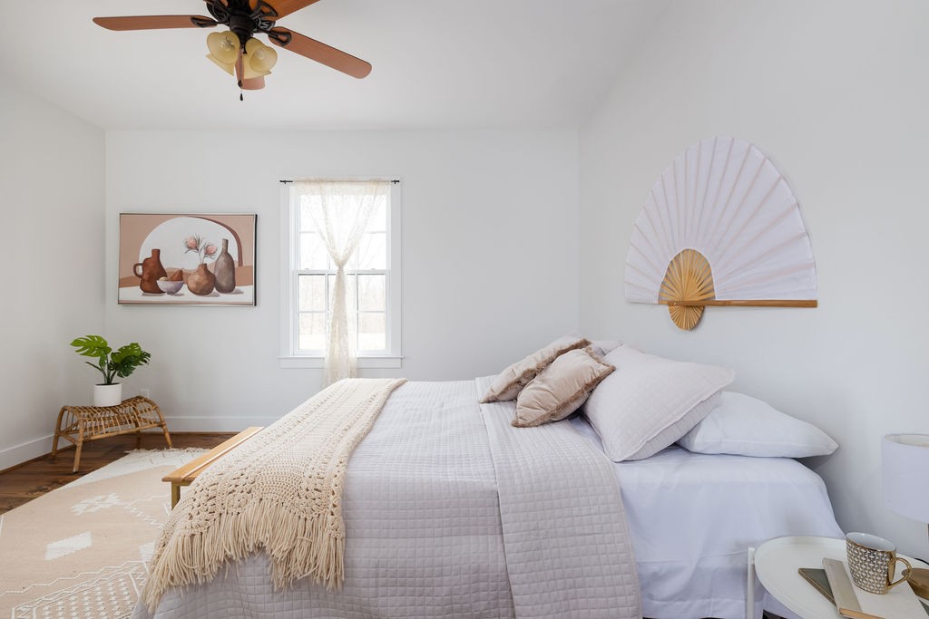 5184 Fire Tower Road Franklin, TN 37064 - Photo 26 of 70 a bedroom with a bed and a chandelier