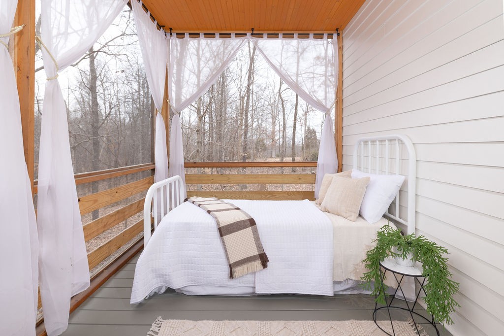 5184 Fire Tower Road Franklin, TN 37064 - Photo 30 of 70 a bed sitting in a bedroom next to a window