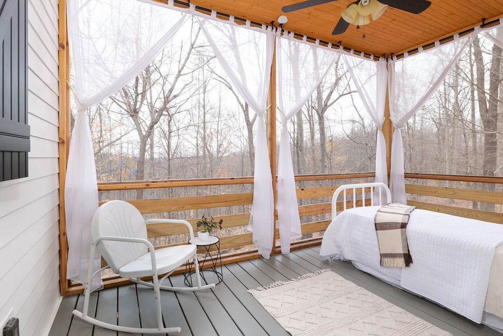 5184 Fire Tower Road Franklin, TN 37064 - Photo 31 of 70 a view of a balcony with table and chairs and wooden floor