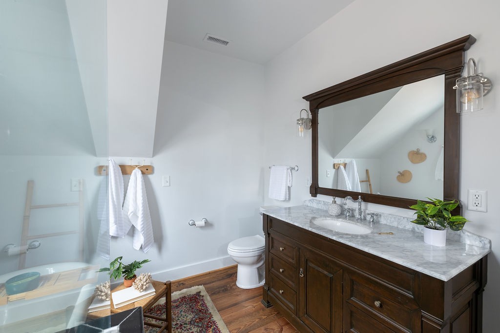 5184 Fire Tower Road Franklin, TN 37064 - Photo 45 of 70 a bathroom with a granite countertop sink and a mirror