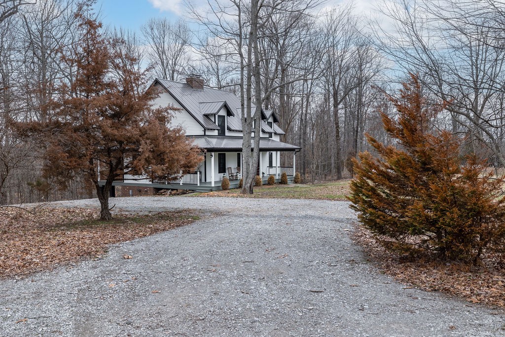 5184 Fire Tower Road Franklin, TN 37064 - Photo 52 of 70 a front view of a house with a yard and garage