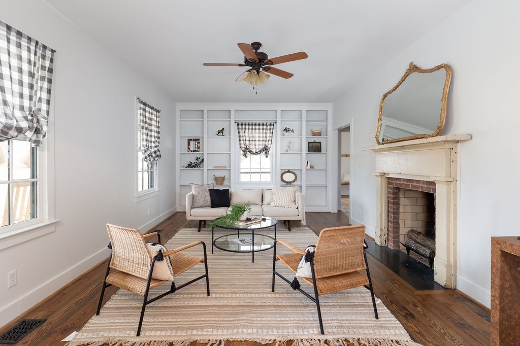 5184 Fire Tower Road Franklin, TN 37064 - Photo 7 of 70 a living room with furniture a fireplace and a window