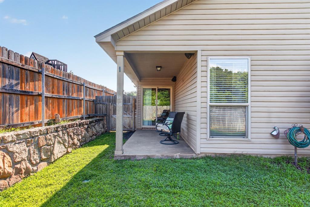 5069 Britton Ridge Lane Fort Worth, TX 76179 - Photo 28 of 32 Sweet covered back porch for quiet mornings or evenings.