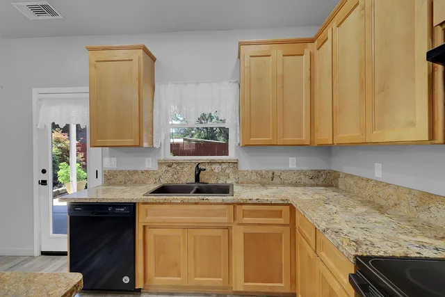 a bathroom with a sink toilet vanity and bathtub