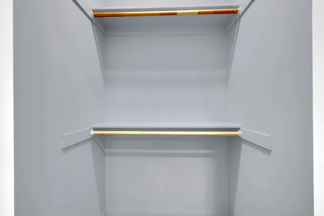 a white toilet sitting next to a bathroom sink