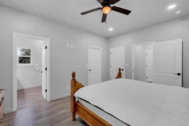 a view of a house with a yard and potted plants